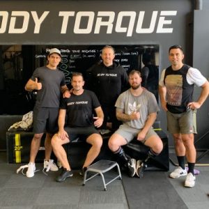 Five middle-aged men, including personal trainers Alex Flint and Phil Chapman, at Body Torque Gym in Newmarket promoting the 21-Day Kickstart programme.